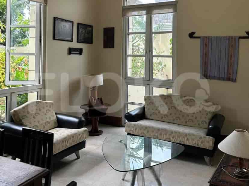 A living room with a sofa, chairs, and a coffee table.