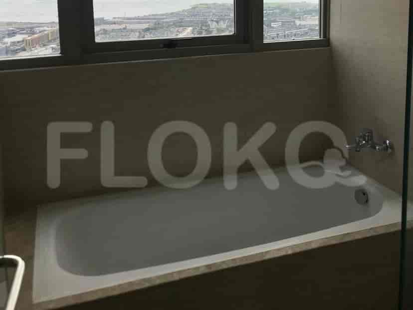 A spacious bathroom with a bathtub.