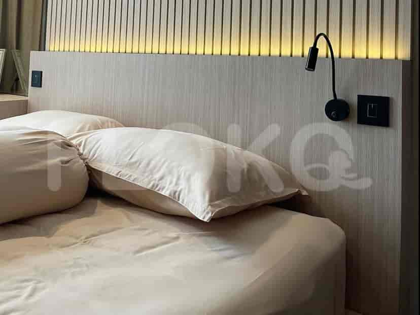 Bedroom with bed and headboard.