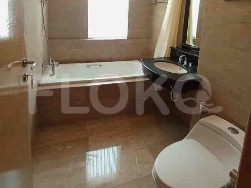 A bathroom with a bathtub, a sink, and a toilet.