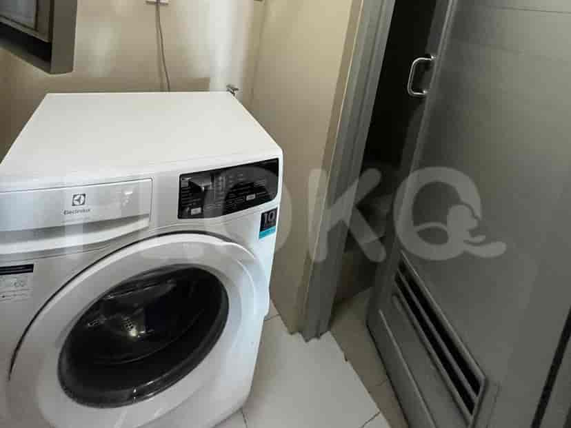 Laundry room with a washing machine.
