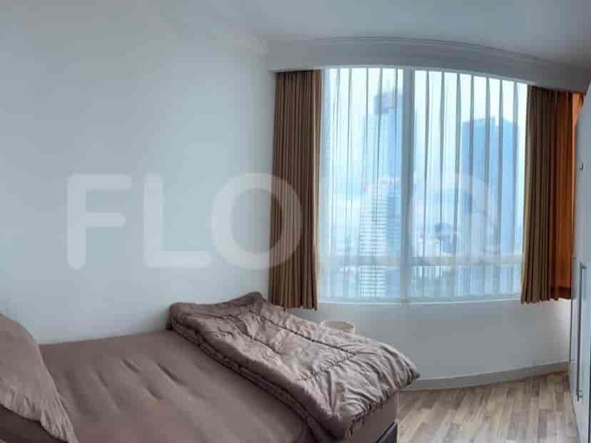 Another bedroom with large windows.