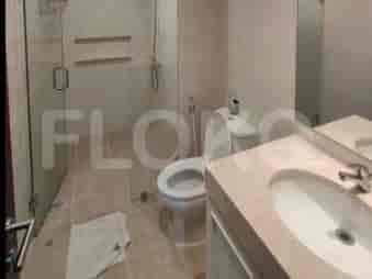 Bathroom with a shower, toilet, and sink.
