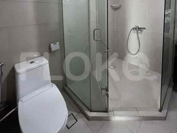 Modern bathroom featuring a glass-enclosed shower and a toilet.