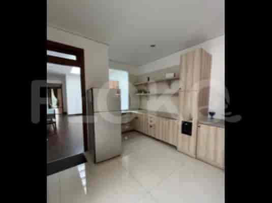 A modern kitchen with light wood cabinetry, a stainless steel refrigerator, and open shelving.