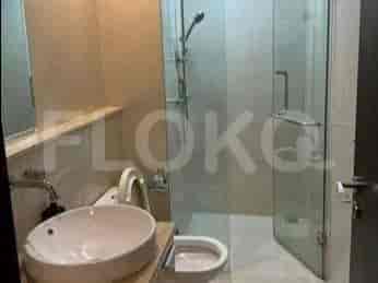 A modern bathroom with a glass shower enclosure.