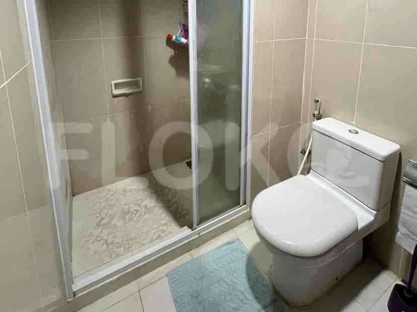 Bathroom with a shower, toilet, and sink.