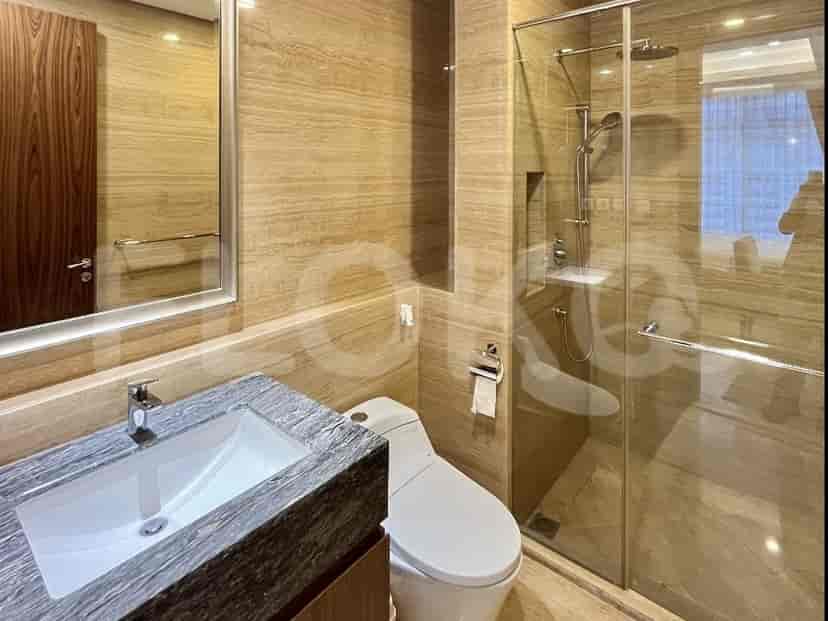 A stylish bathroom featuring a modern design and a glass shower.