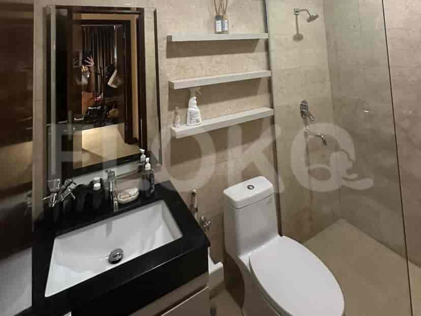 A bathroom with a sink, mirror, and shower.