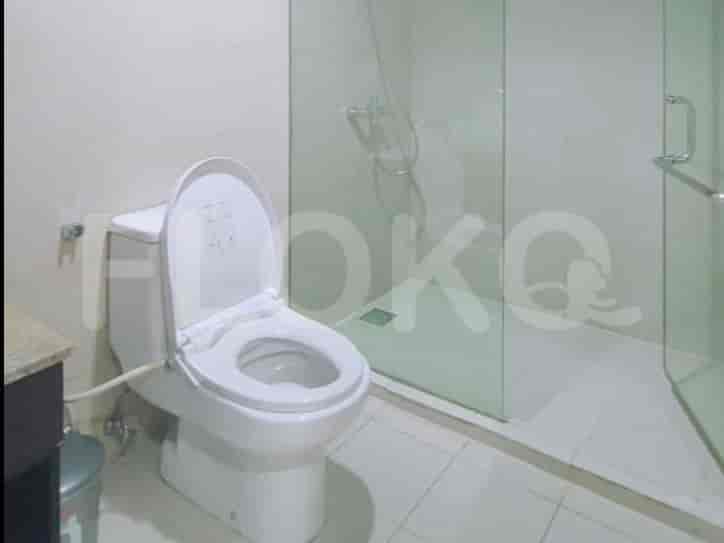 Bathroom with a toilet, shower stall, and modern design.