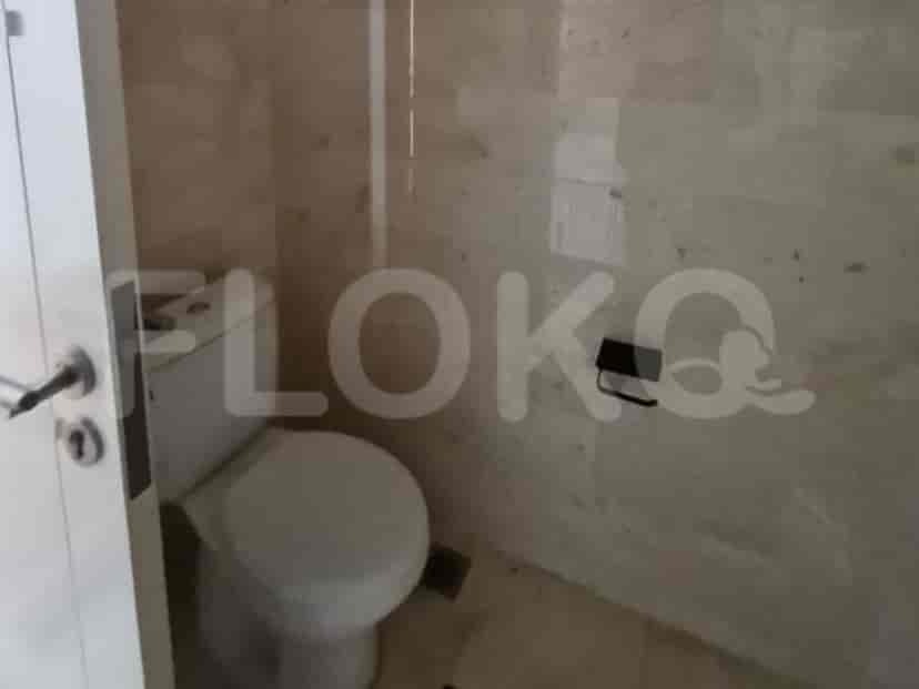 Bathroom with shower and marble walls.
