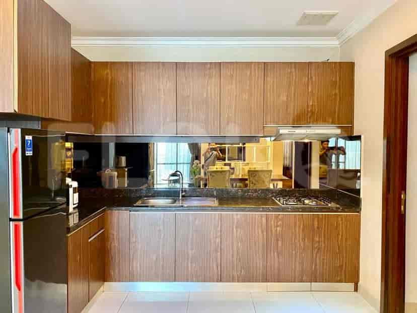 A well-equipped kitchen with wooden cabinets and a stainless steel sink.