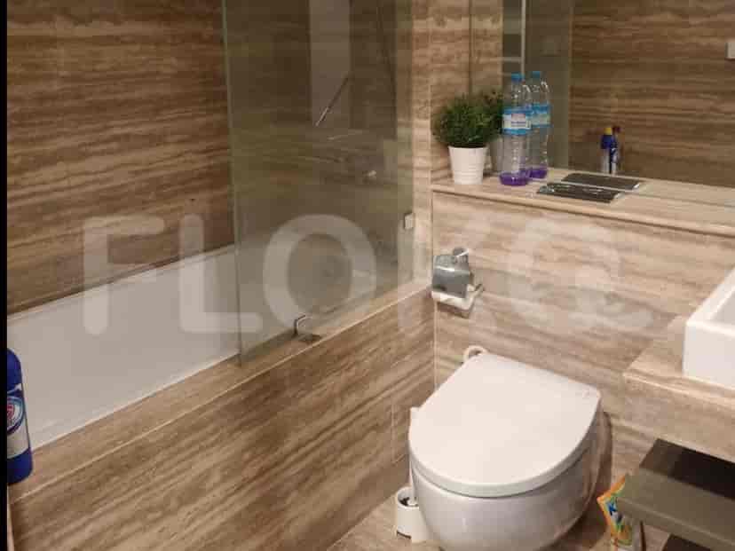 A bathroom with a bathtub, shower, and a mirror.