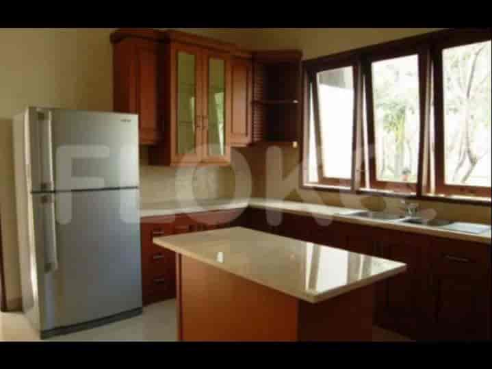 A kitchen featuring wooden cabinetry, granite countertops, and stainless steel appliances.