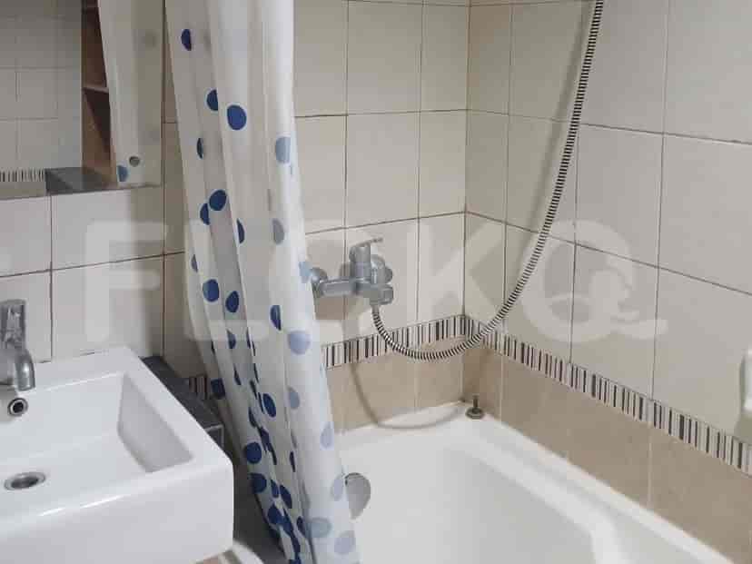 Bathroom with bathtub and shower curtain.