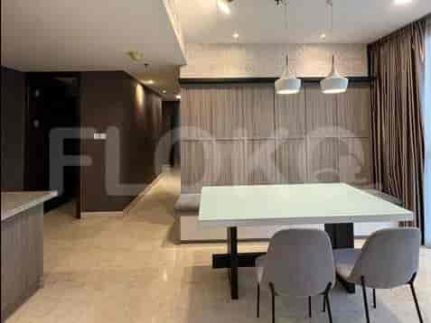 A spacious bathroom with a bathtub, toilet, and vanity with a sink.