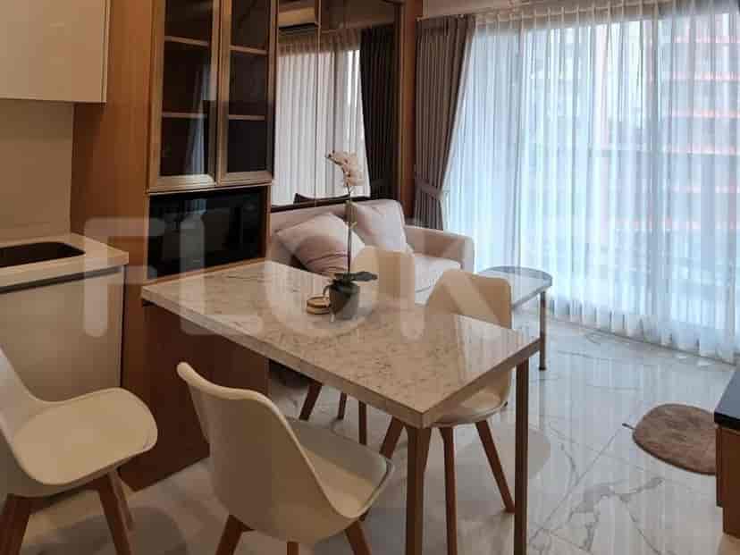 A compact living and dining area with a marble-top dining table, four chairs, a sofa, and a large window.