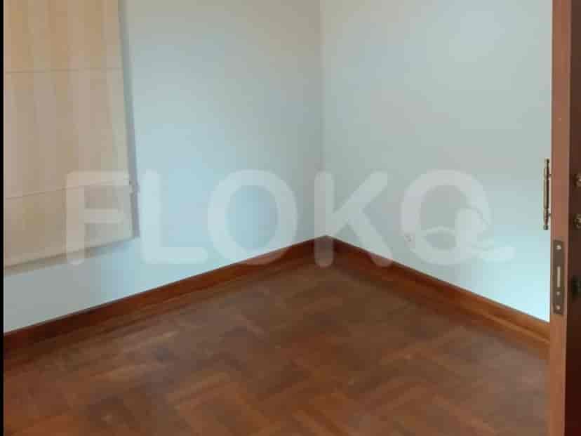 Bedroom with wooden flooring.