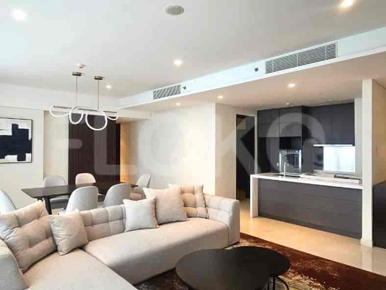 An open-plan kitchen with dark cabinetry and a central island.