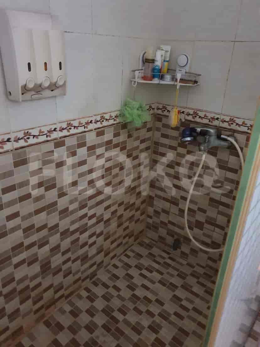 Shower with various toiletries.