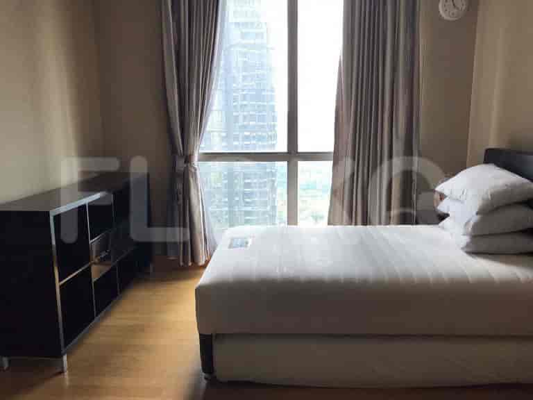 Bedroom with a double bed and storage unit.