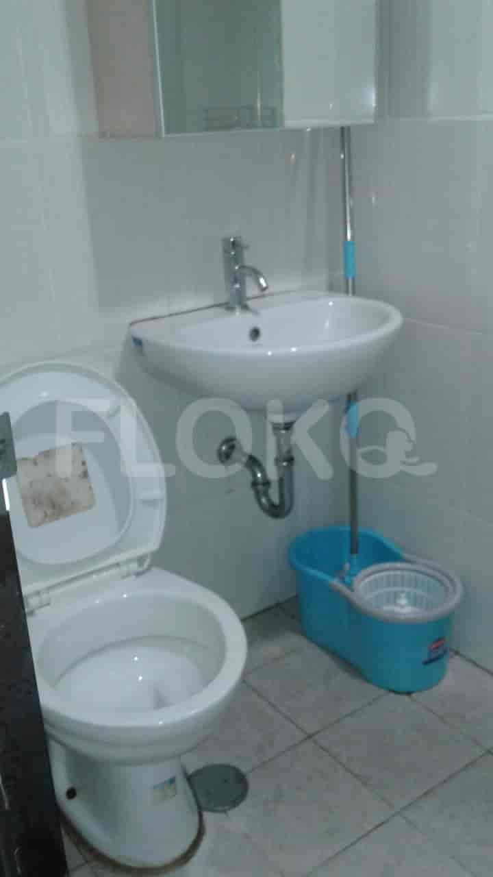 Small bathroom with a sink, toilet, and basic fixtures.