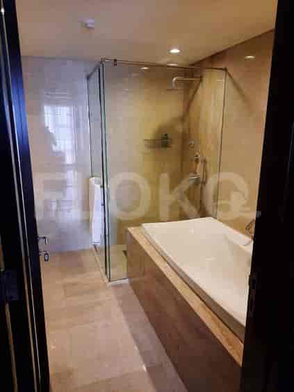 A modern bathroom with a bathtub and a shower.