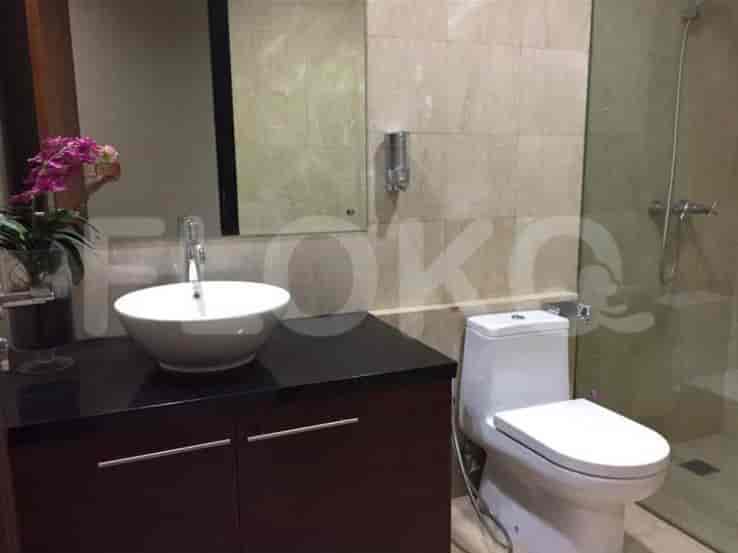 Bathroom with a sink, shower, and toilet.