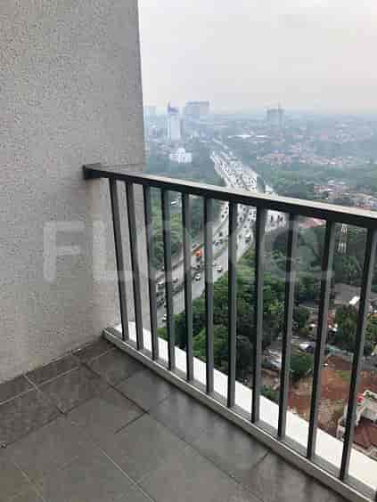 Balcony overlooking a cityscape.