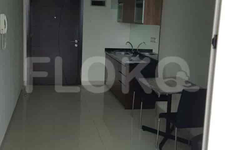 A compact living space with a kitchenette and dining area.