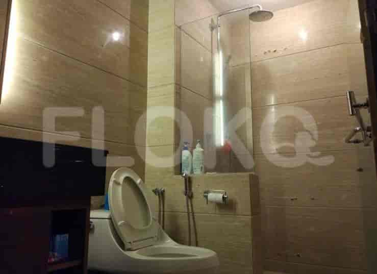 Modern bathroom with shower and toilet.