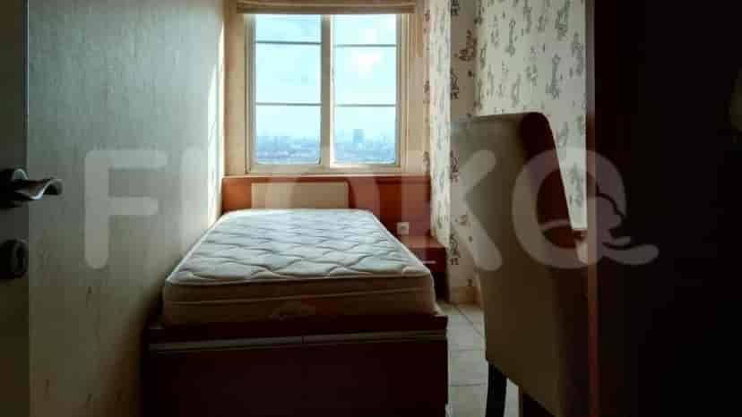 Small bedroom with a single bed and a window.