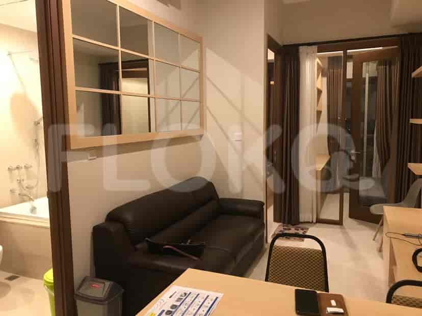 View of the combined living space with access to the bathroom and bedroom.