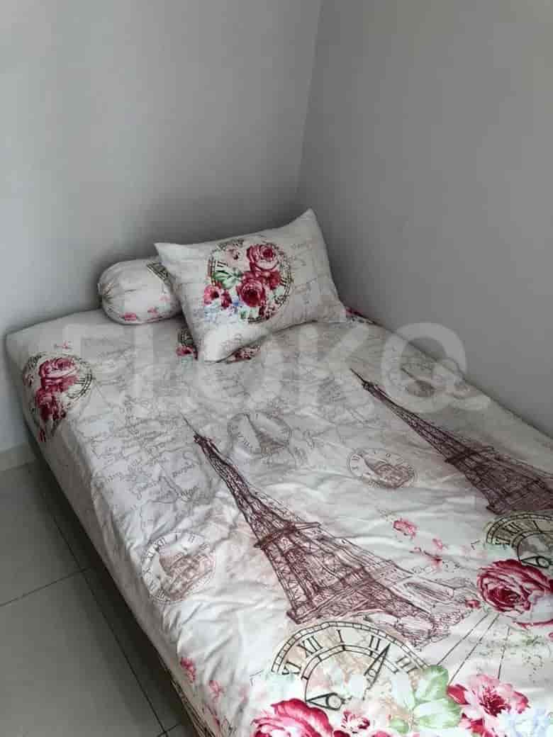 Bedroom with a single bed, Paris-themed bedding, and a window.