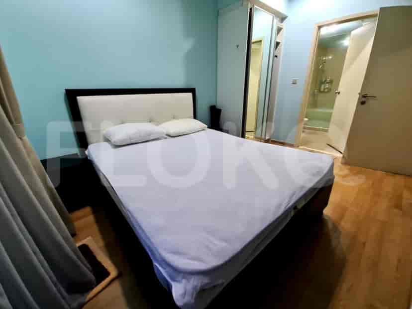 Bedroom featuring a bed, closet, and light-colored walls.