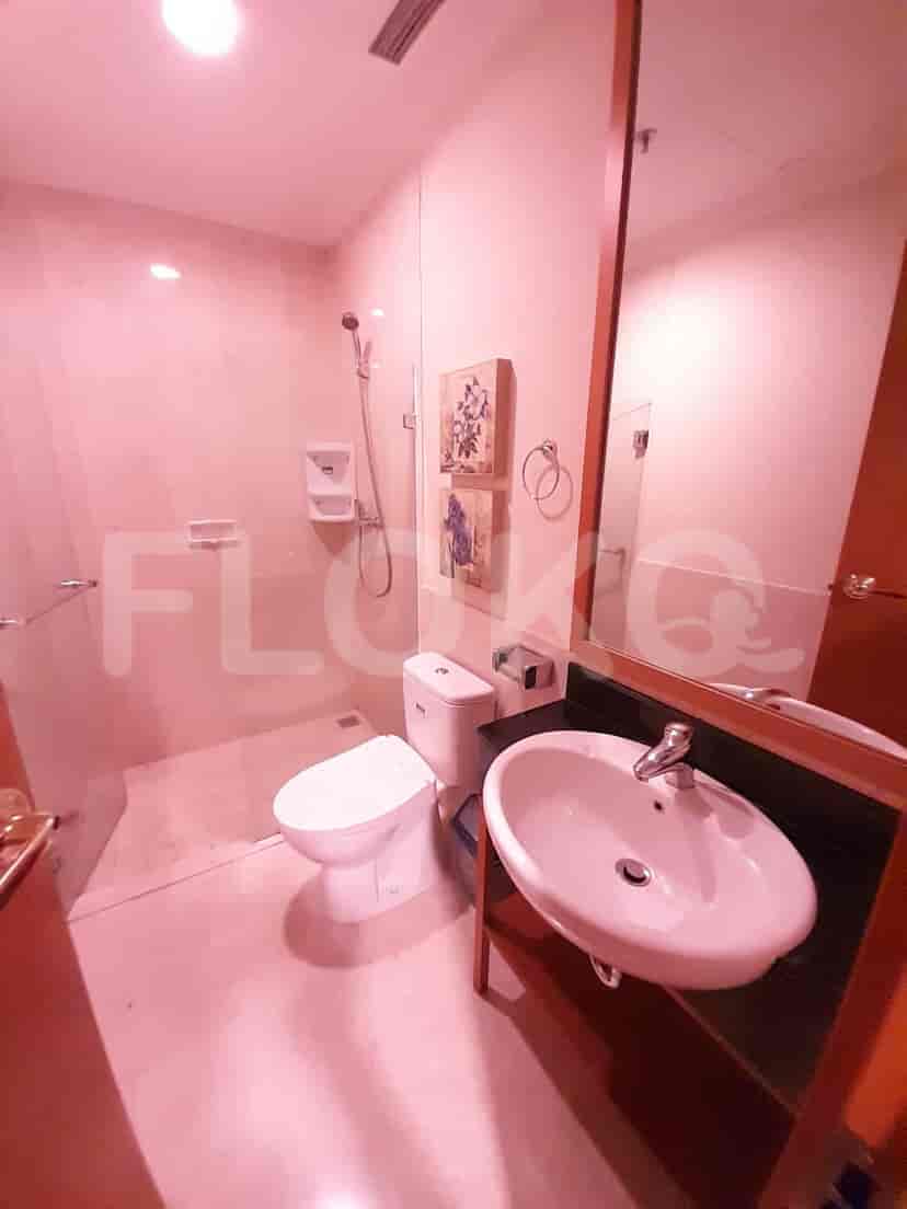 Bathroom with a glass-enclosed shower.
