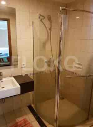 A bathroom with a shower, sink, and mirror.