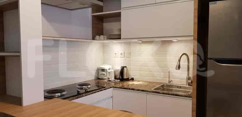 Modern kitchen with white cabinets and appliances.