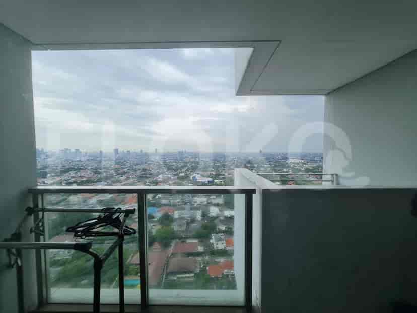 A balcony with a view of the city.