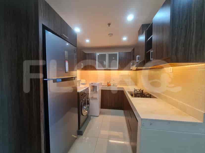 A modern kitchen equipped with stainless steel appliances and ample storage.