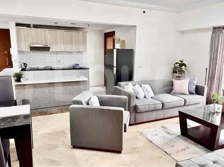 An open-plan living and kitchen area, emphasizing a modern aesthetic and functionality.