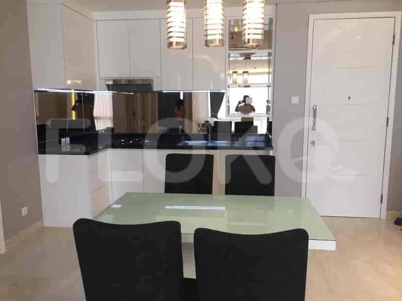 Open-concept kitchen and dining area with modern appliances and dining set.