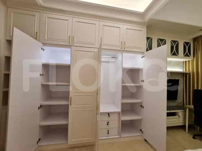 A large wardrobe with many sections and doors.