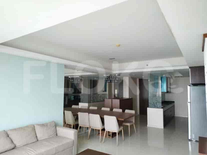 A modern living space that seamlessly integrates the living and dining areas.