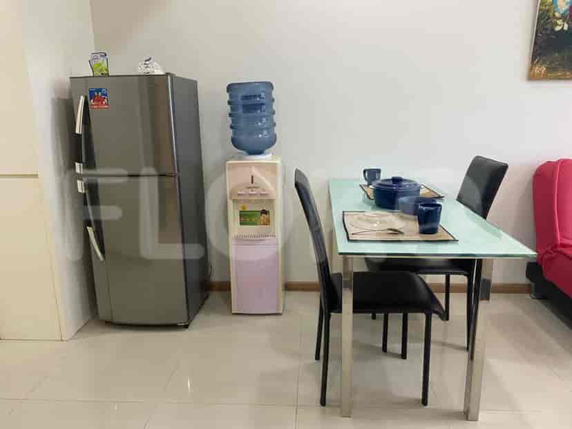 Dining area featuring a glass table and chairs.