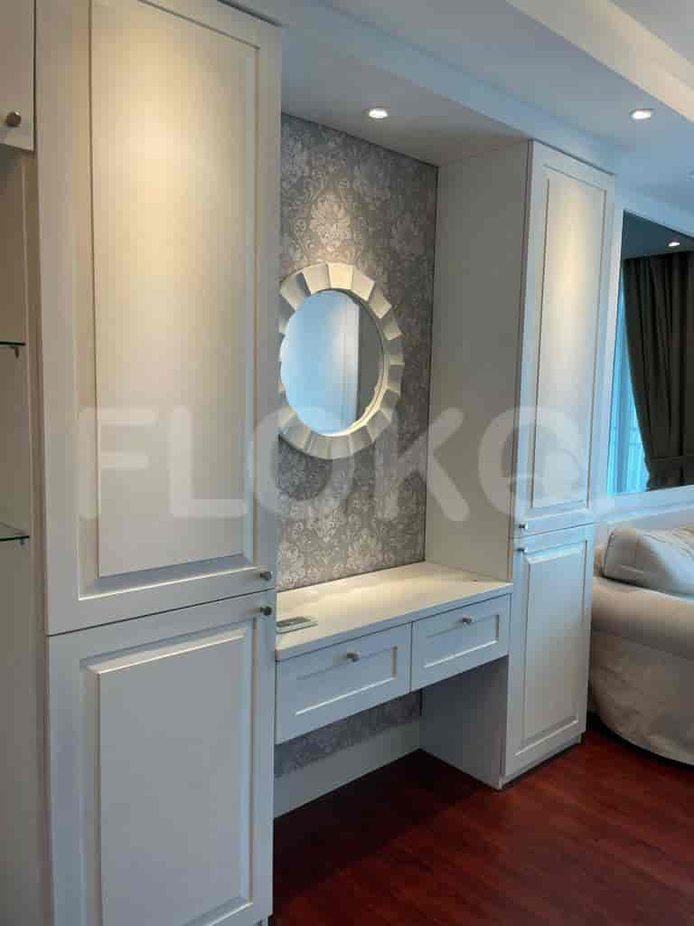 Living room with a vanity area, mirror, and a modern design.