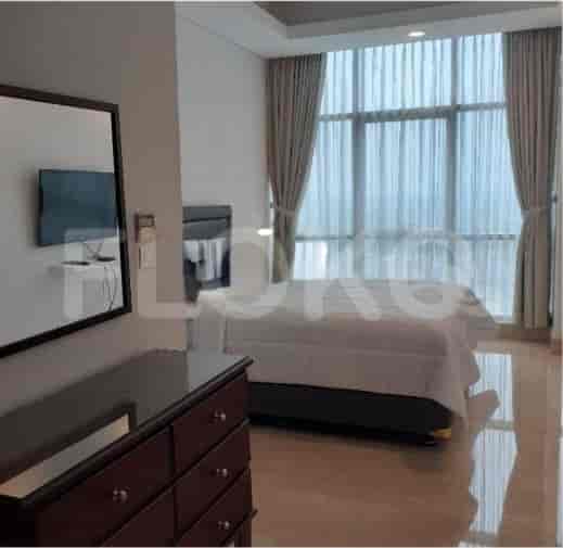 A modern bedroom with a bed, dresser, and a large window with curtains.