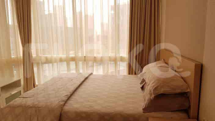 Bedroom with a bed and curtains.