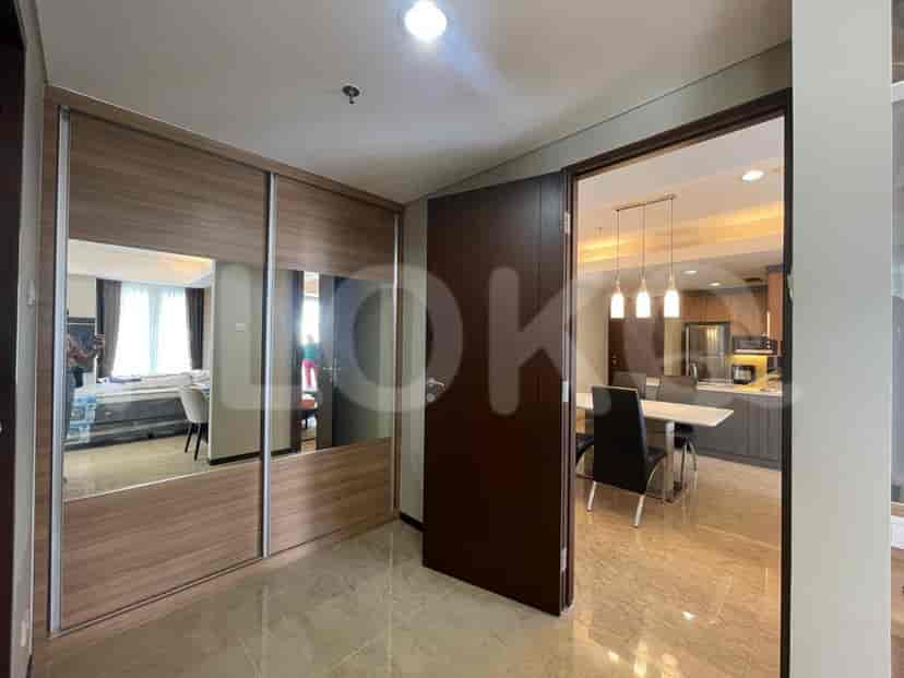 A view of a hallway with a wardrobe and access to the dining and sleeping areas.