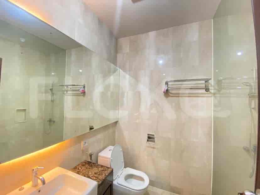 Modern bathroom with a large mirror, sink, and contemporary design.